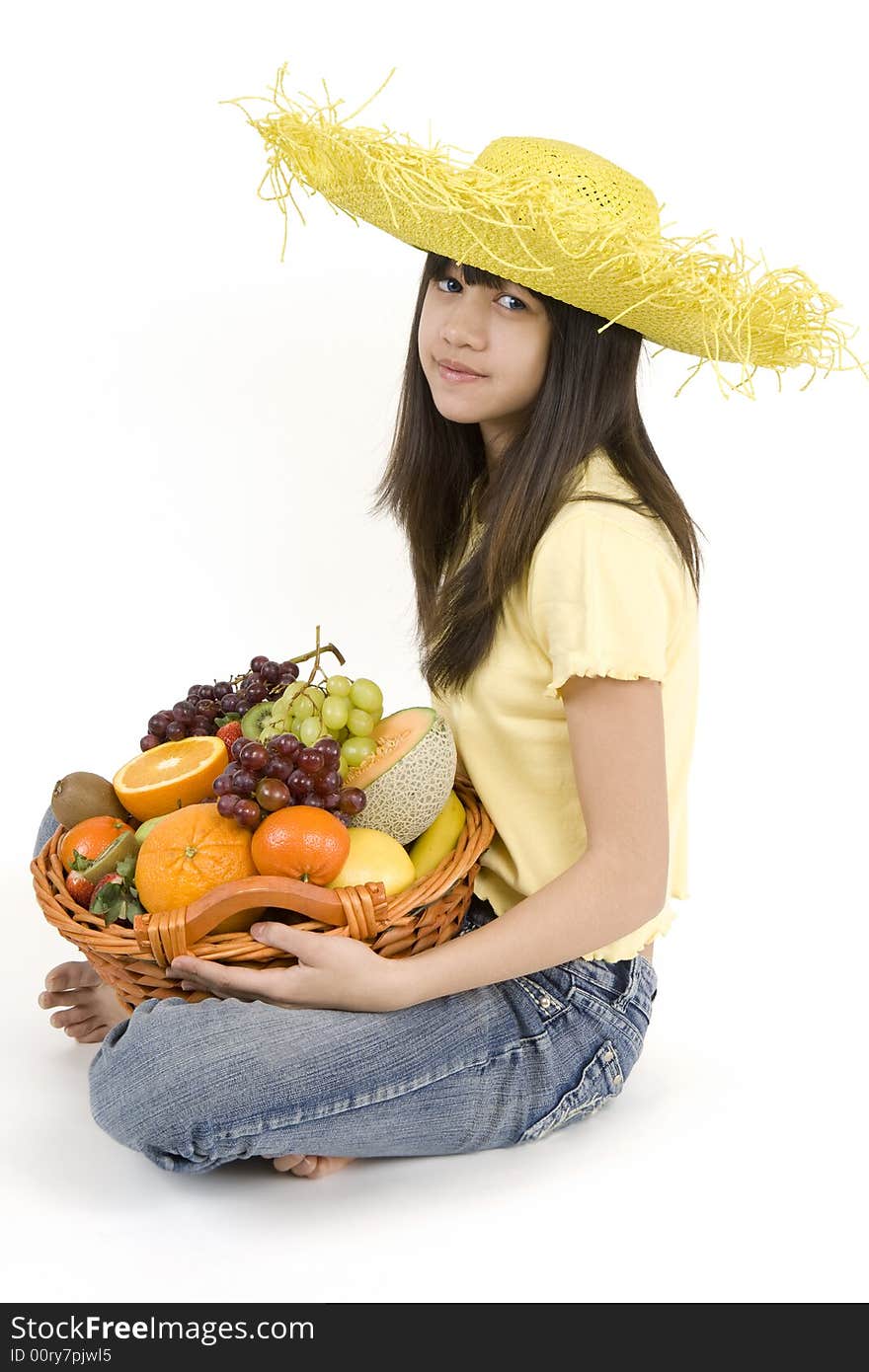 Teenager with fruit basket before white background