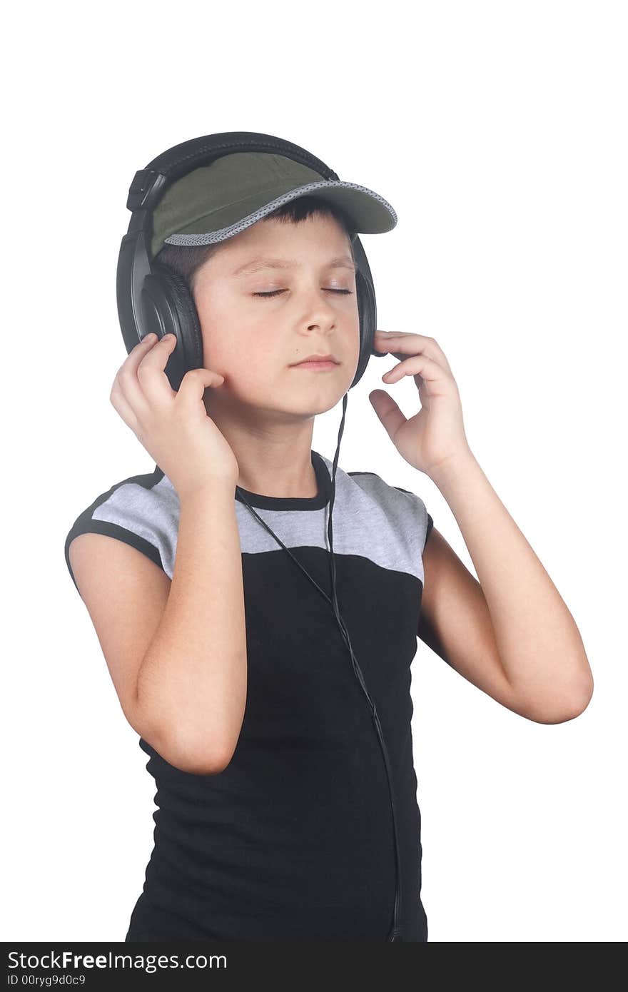 Young boy listening to music isolated