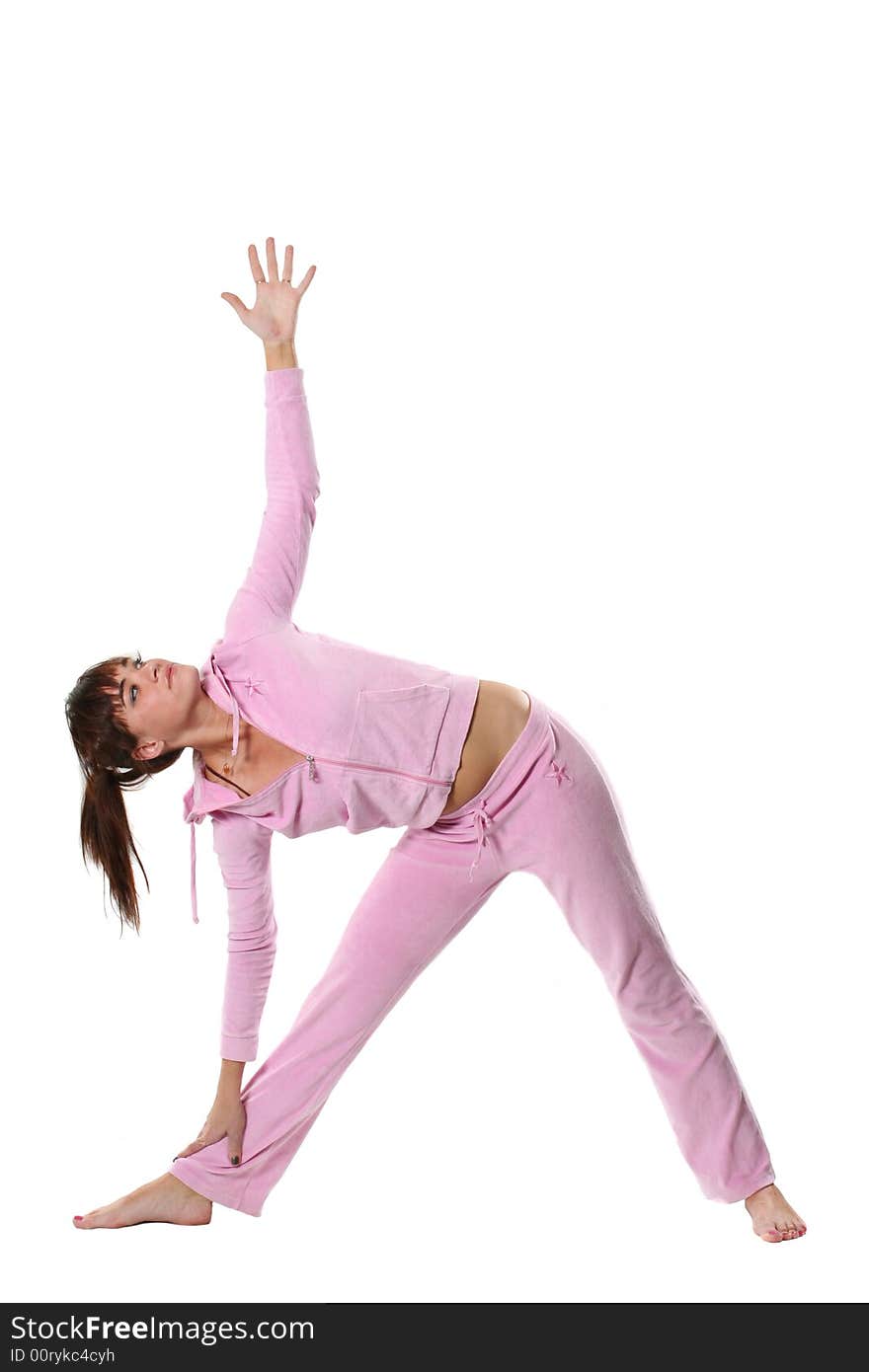 The girl in pink clothes is engaged in yoga. The girl in pink clothes is engaged in yoga