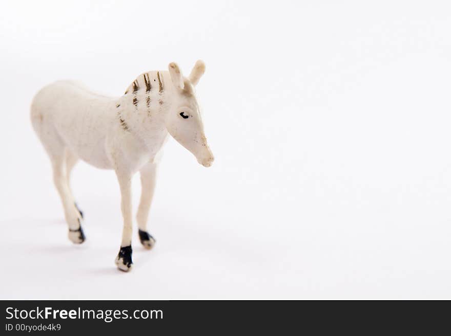 Single horse toy figure macro white background