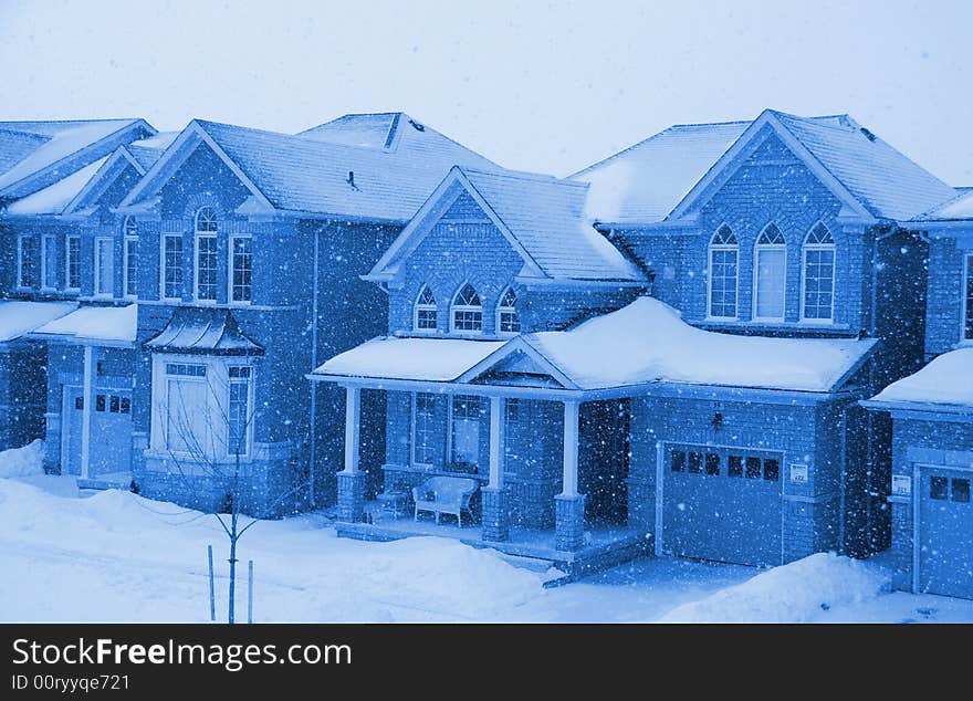 Blue homes in the winter snow. Blue homes in the winter snow.