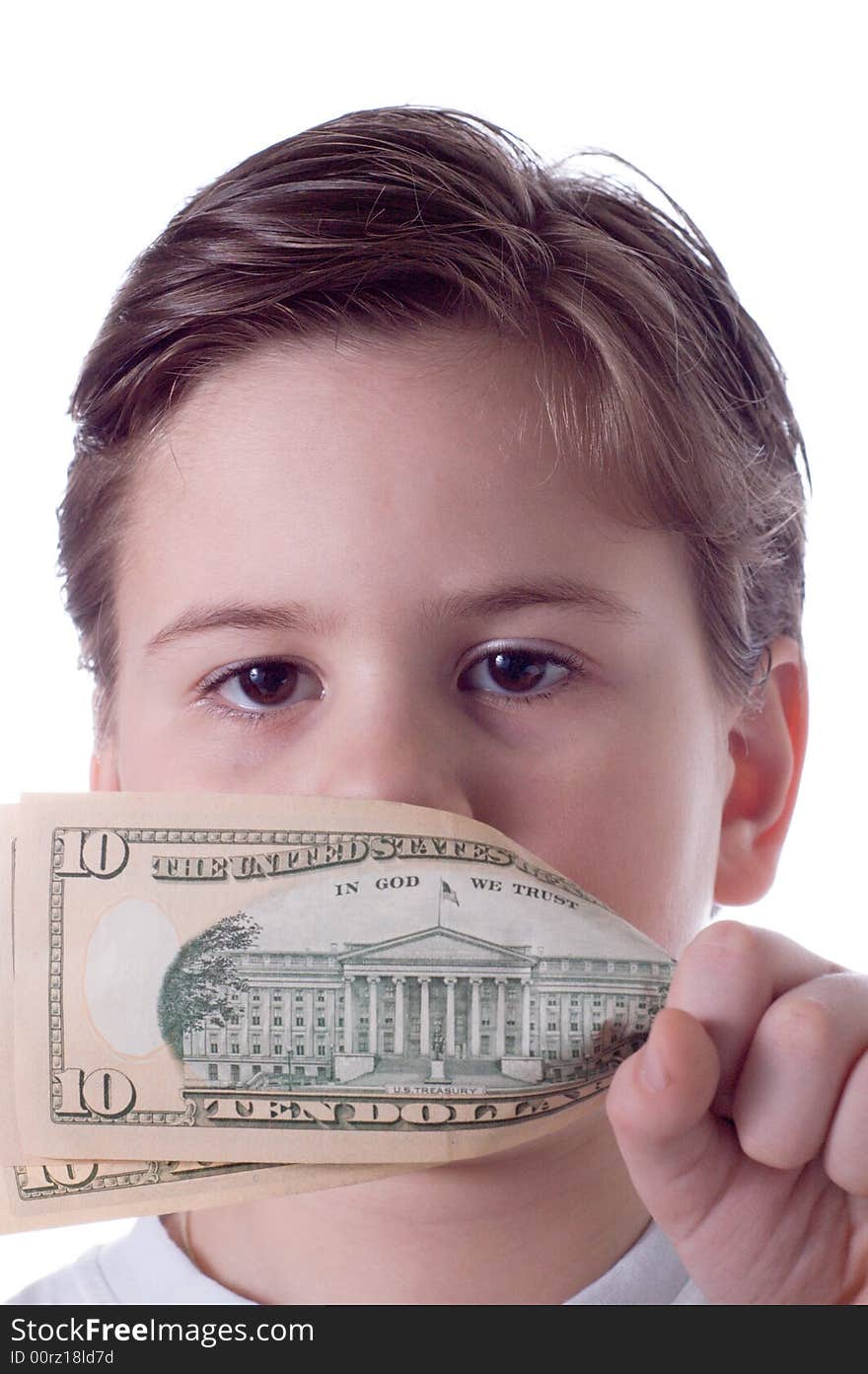 The little boy covers a mouth with money. The little boy covers a mouth with money