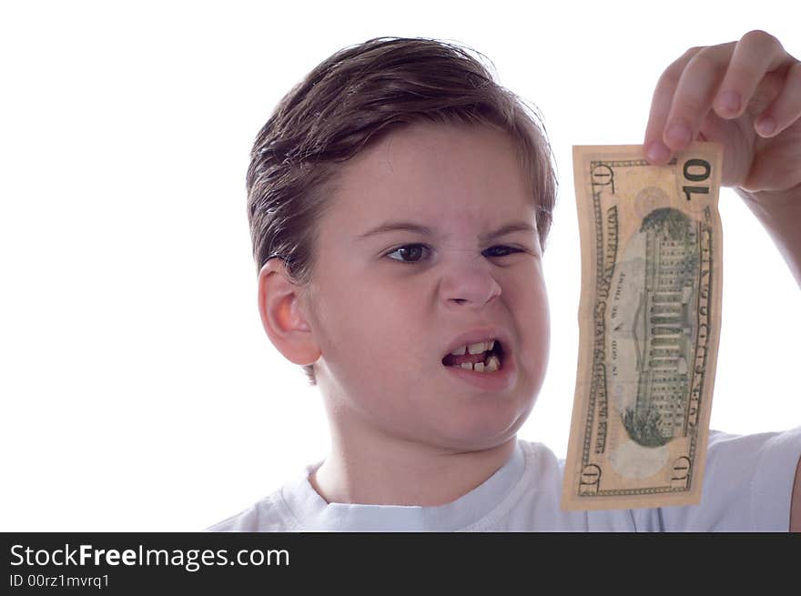 The little boy looks at money which holds in a hand. The little boy looks at money which holds in a hand