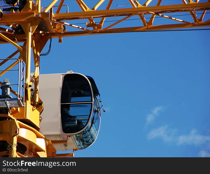 A closeup shot of a crane cab. Ideal for construction advertisement. A closeup shot of a crane cab. Ideal for construction advertisement