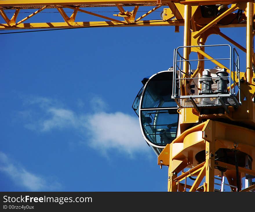 A different angle of a crane against a clear blue sky. A different angle of a crane against a clear blue sky.