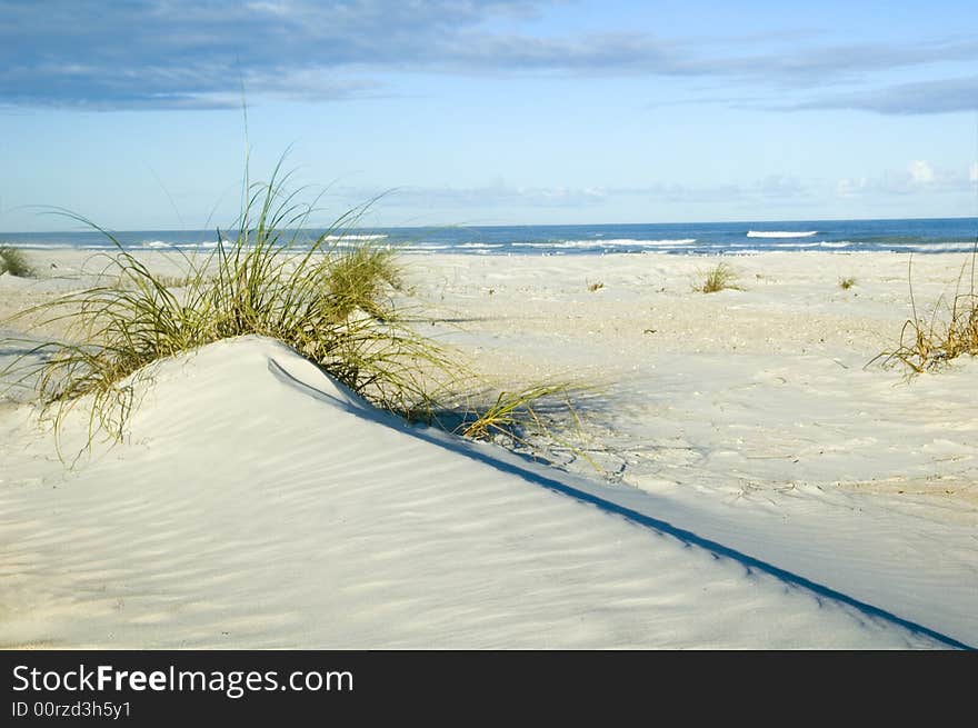 Sand dune with strong diagonal line and beautiful blue sky. Sand dune with strong diagonal line and beautiful blue sky