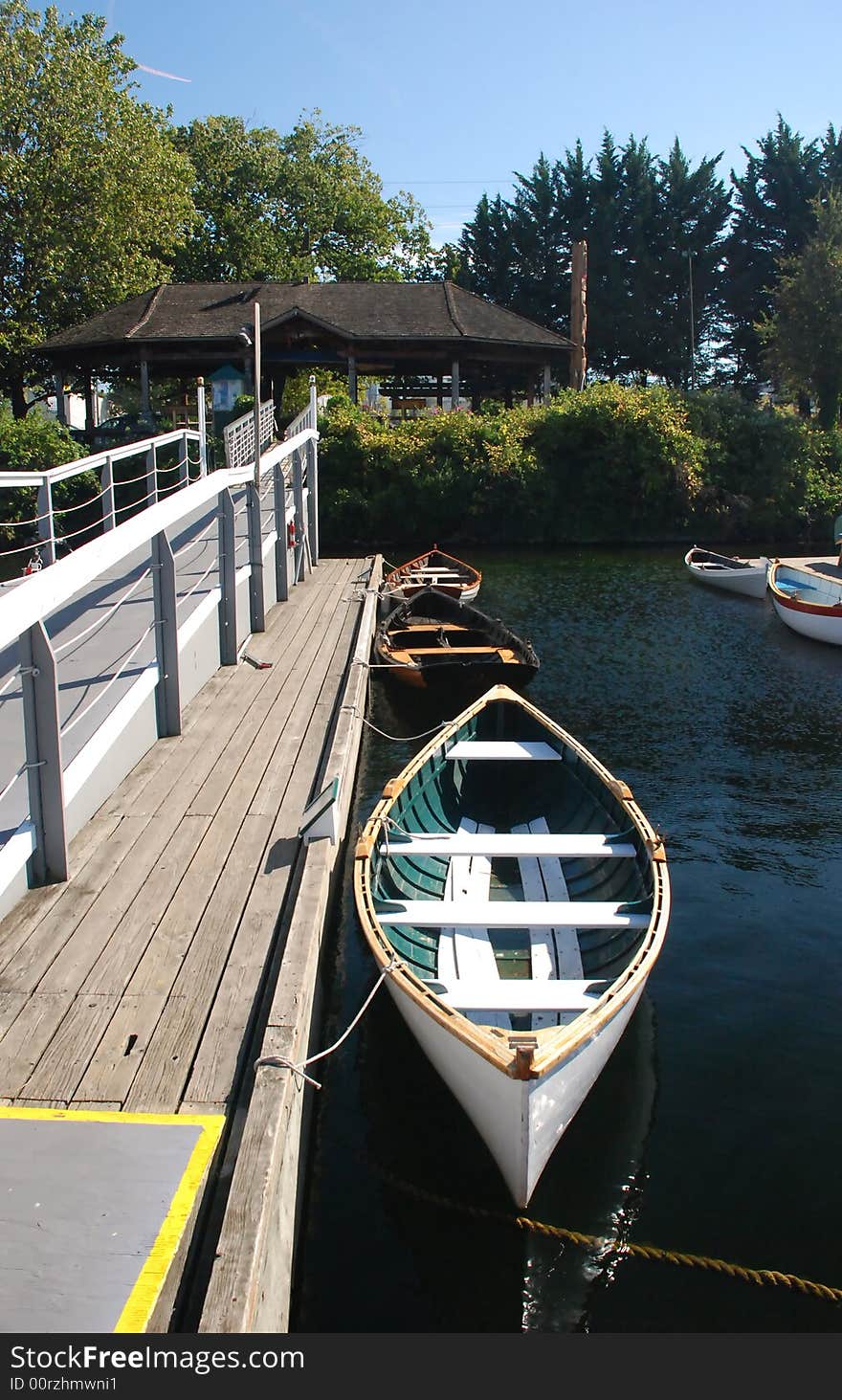 Canoes tied up along a dock and walkway