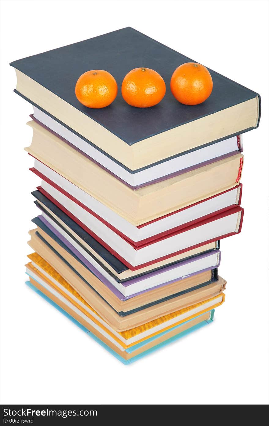 Stack of books with three mandarins