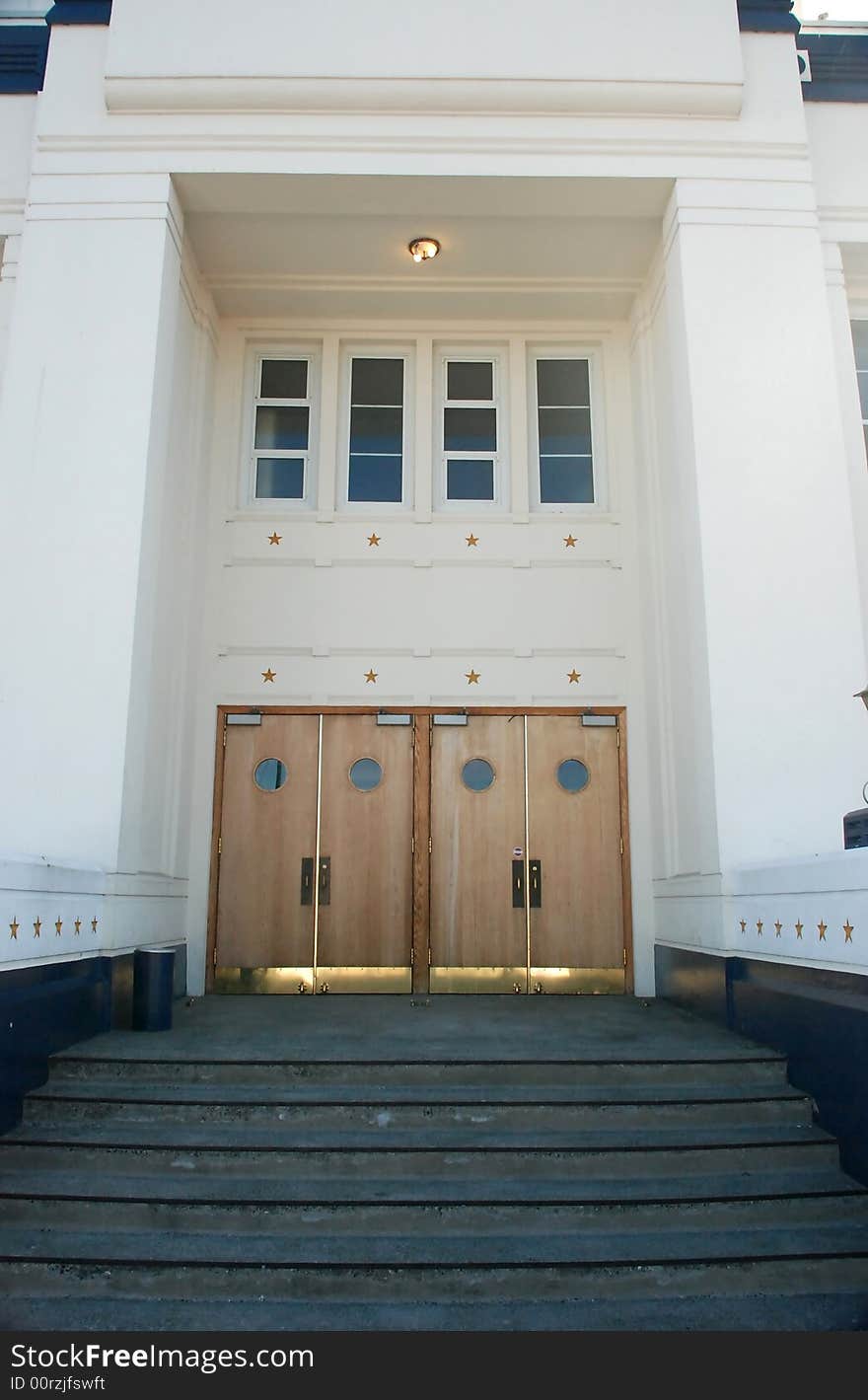 Formal building with wooden doors and golden stars