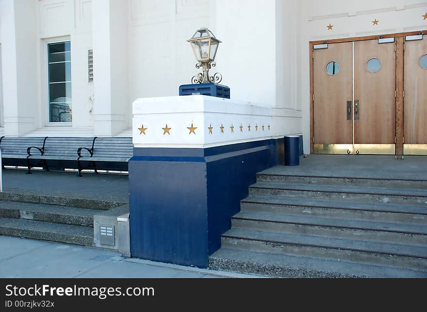 Formal building with wooden doors and golden stars