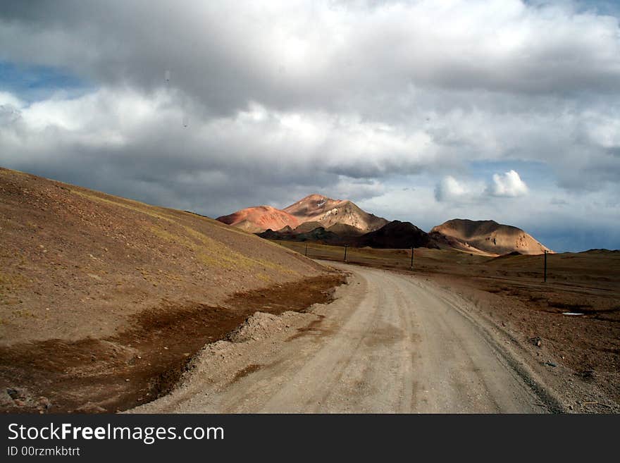 Lonely road of highland  pamirs tibet，wide, broadly, snow, cold, altiplano，central asia, aksai chin area. Lonely road of highland  pamirs tibet，wide, broadly, snow, cold, altiplano，central asia, aksai chin area.