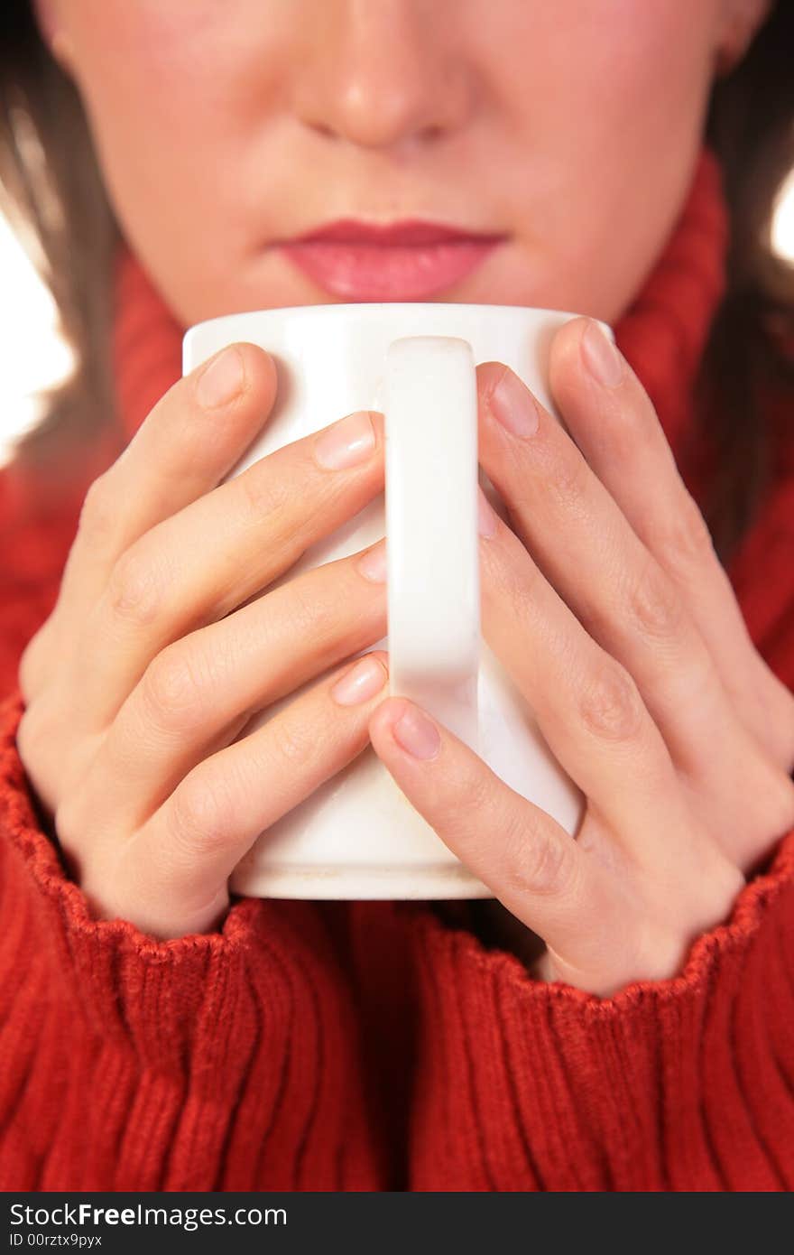 Young woman with cup in hands