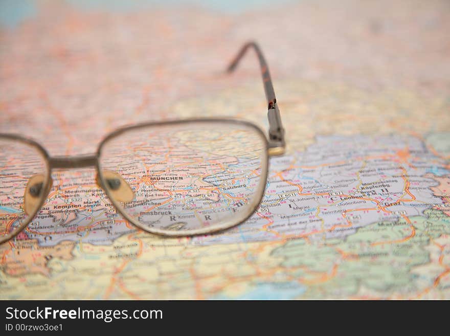 Close-up of glasses on map of europe