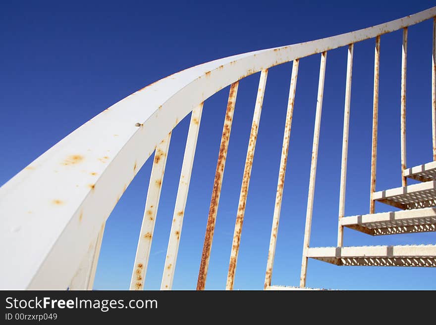 Curved metal hand rail and stairs. Curved metal hand rail and stairs.