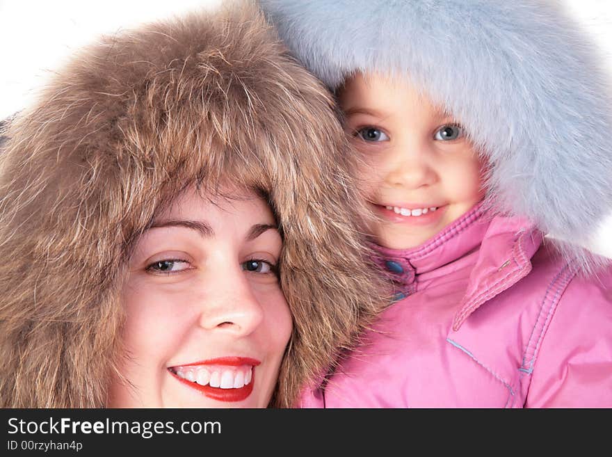 Mother with child in furry hats