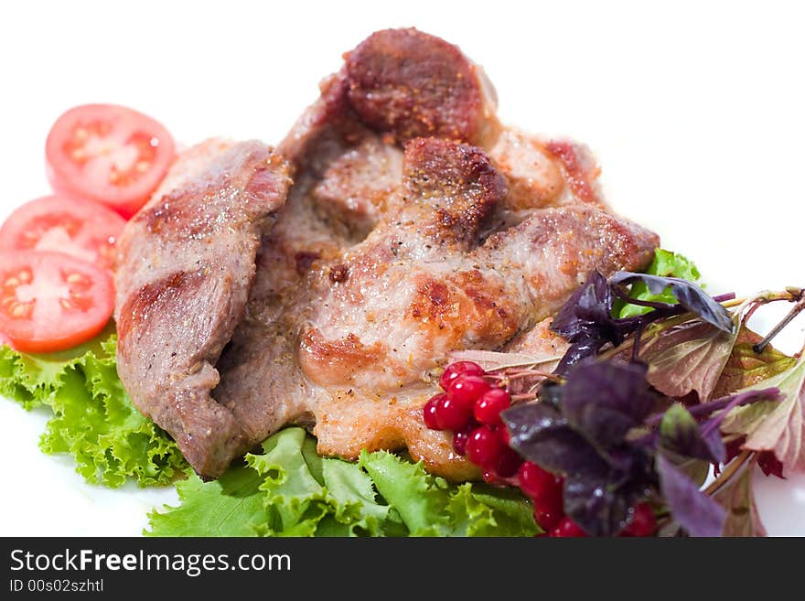 Appetizing pieces of roasted meat on the plate