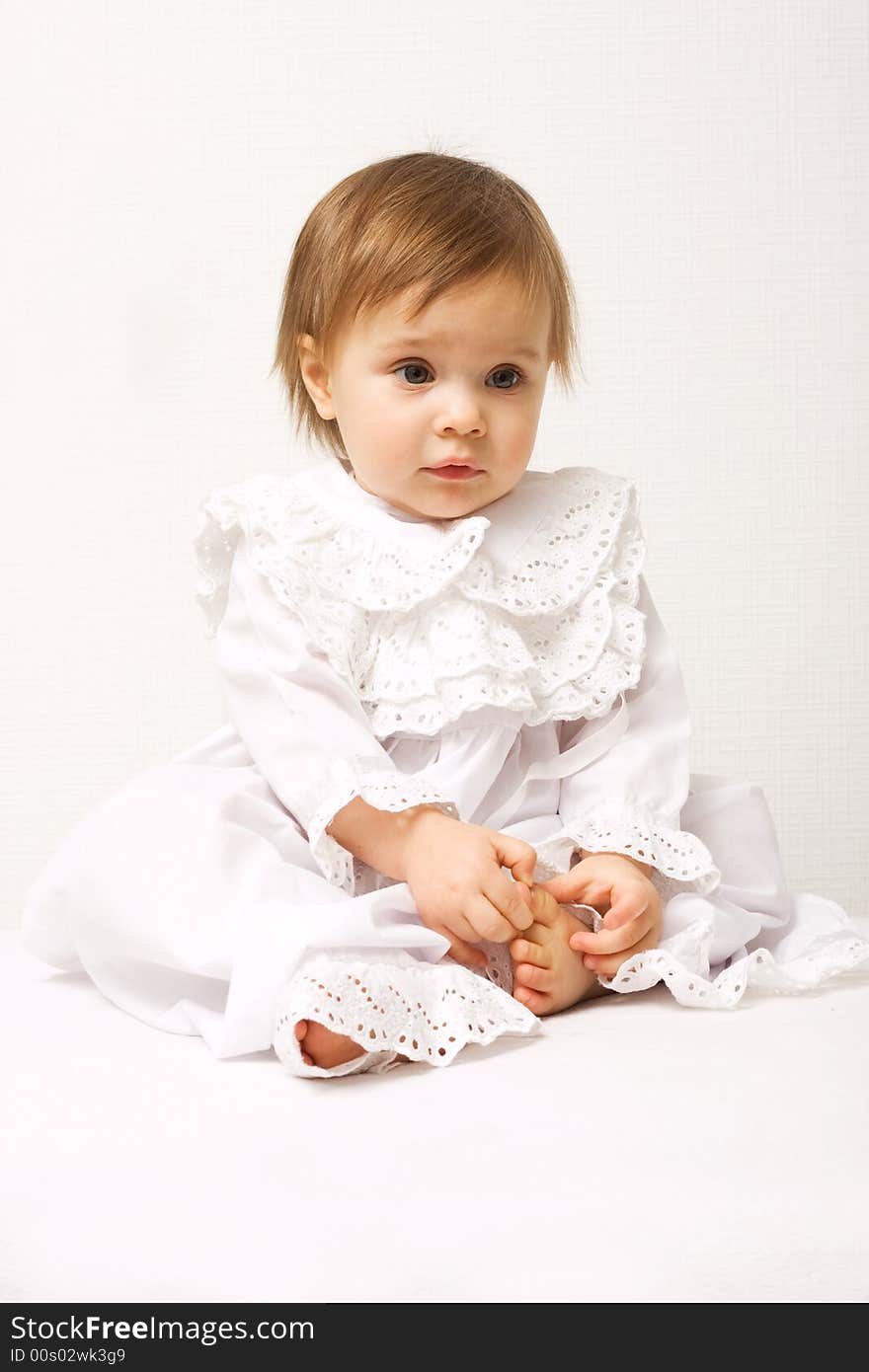 Cute one year old girl in white dress. Cute one year old girl in white dress