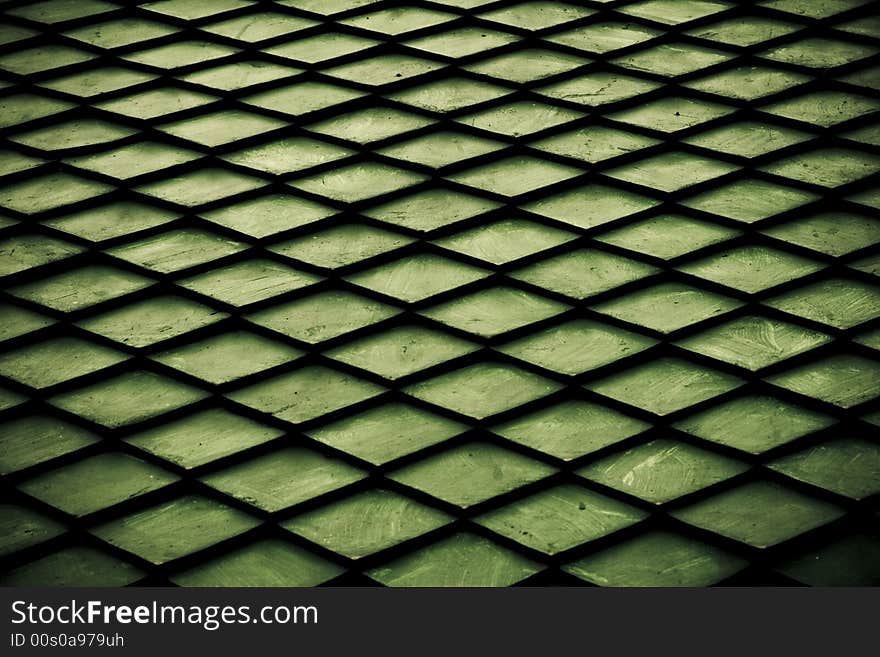 Green pattern created with a black net. Green pattern created with a black net