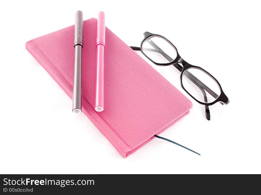 Purple book, glasses and markers