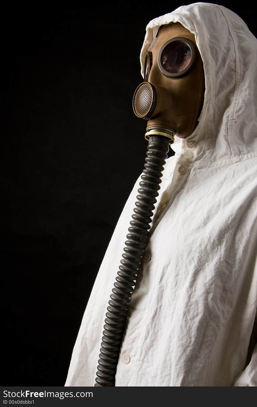 Person in gas mask on dark background