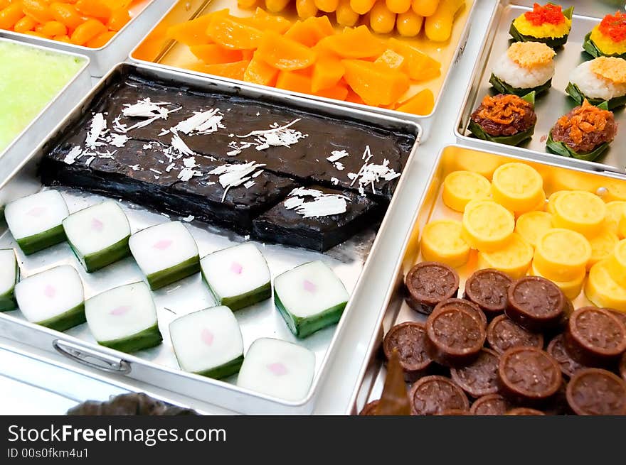 An assortment of traditional candies on white plate