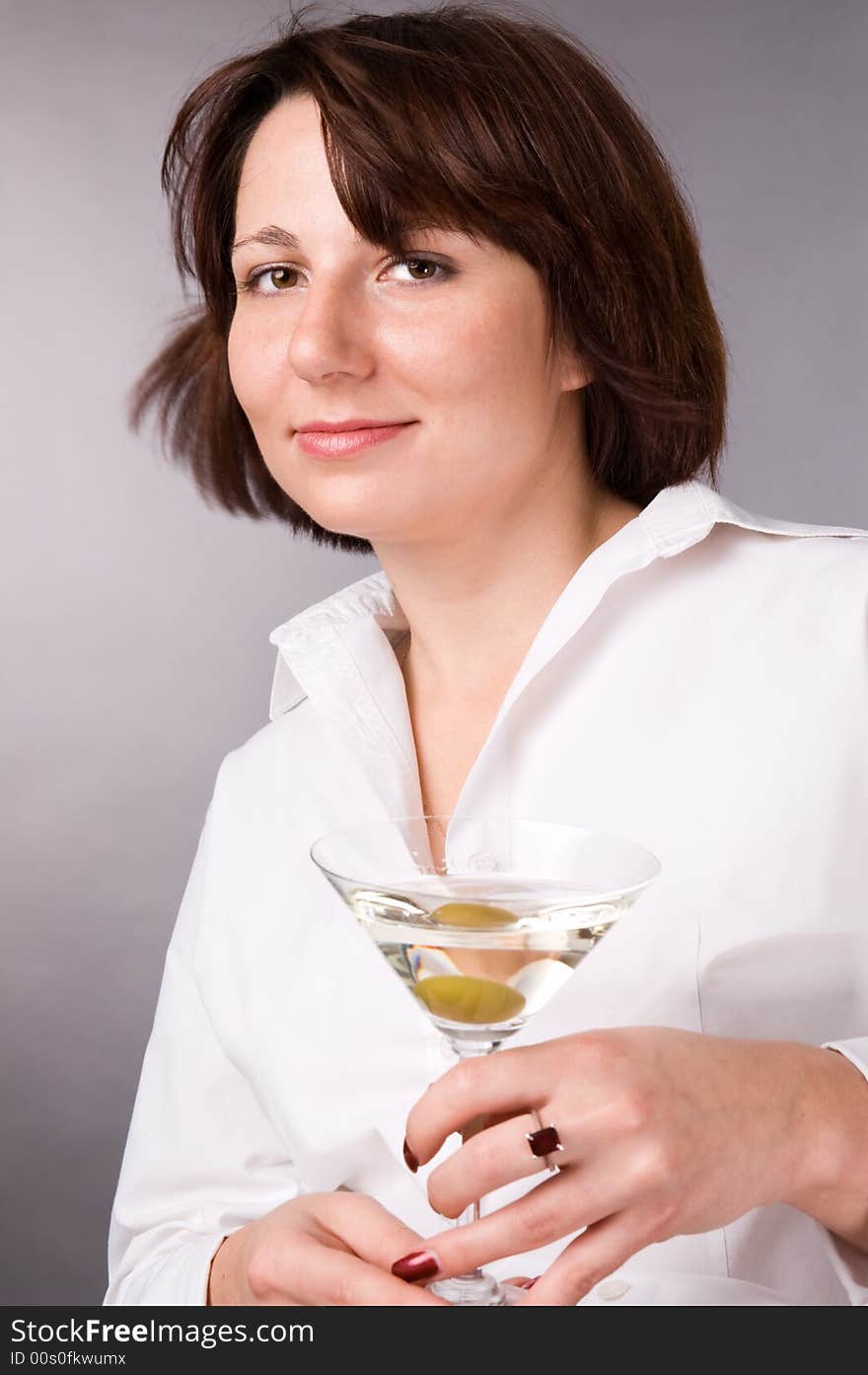 The woman with a glass of martini