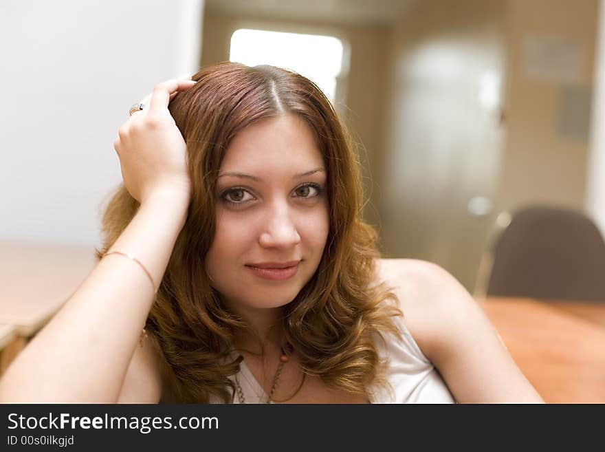 Smiling pretty brunette in a room #2