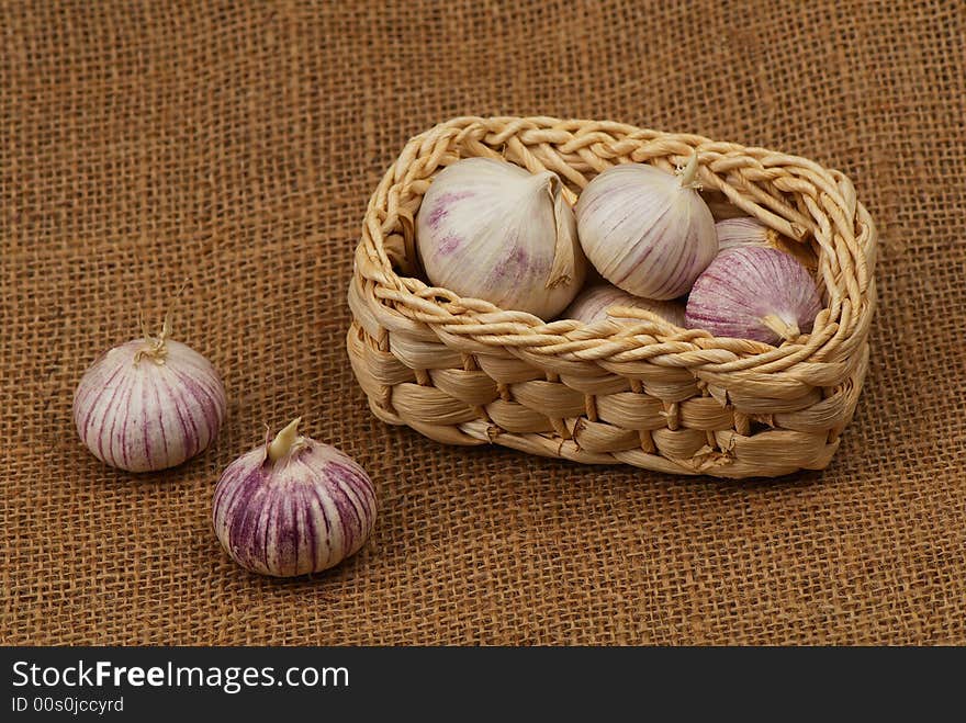 Garlic in the small basket. Garlic in the small basket