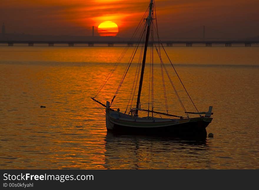 River Tagus estuary at Alcochete harbour close to Lisbon via the Vasco da Gama long span one can see in the horizon. River Tagus estuary at Alcochete harbour close to Lisbon via the Vasco da Gama long span one can see in the horizon.