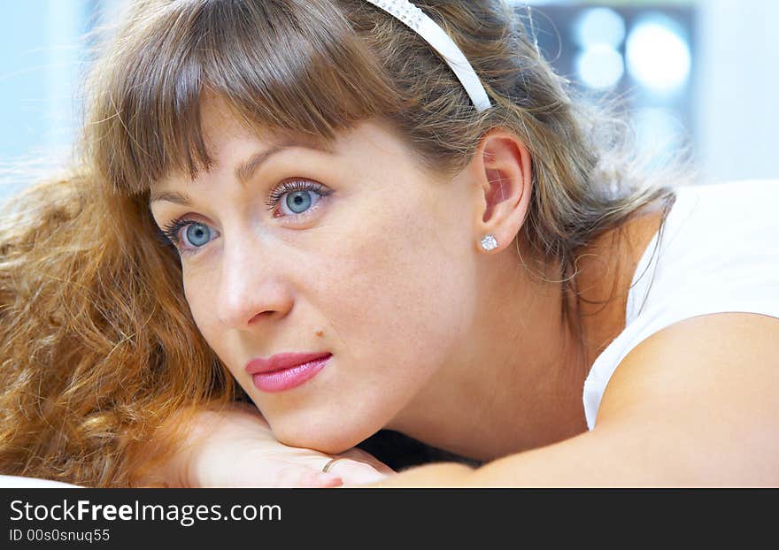 High key portrait of young woman in her bedroom. High key portrait of young woman in her bedroom