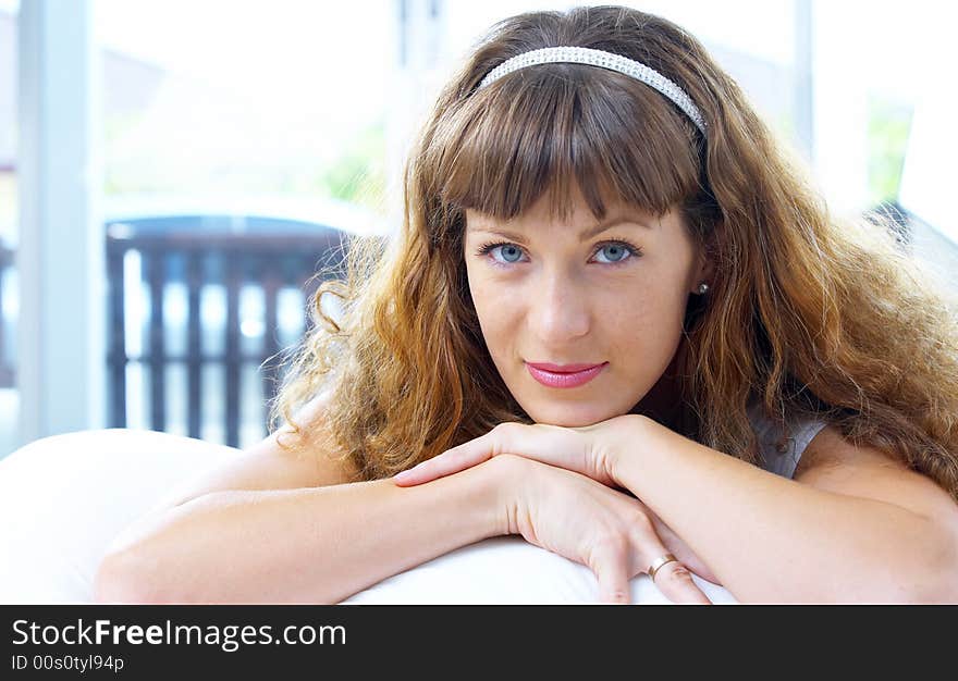 High key portrait of young woman in her bedroom. High key portrait of young woman in her bedroom