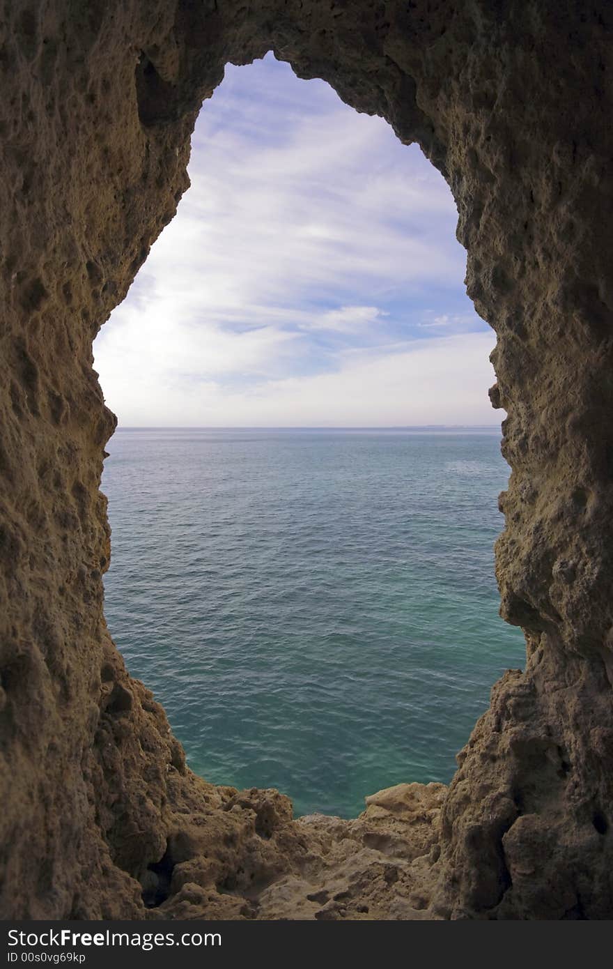 Natural hole in a rock  near Carvoeiro in Portugal