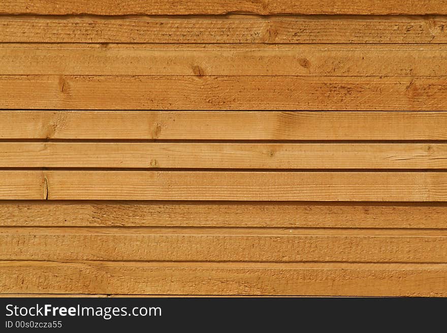 A photo of wooden wall of some suburban house or a shed.