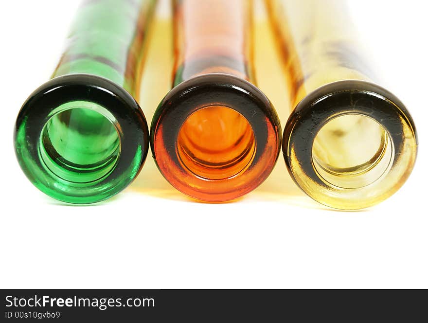 Colorful glass bottles on white. Colorful glass bottles on white