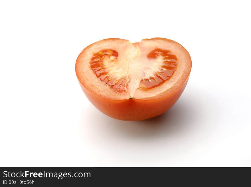 Half of tomato on white