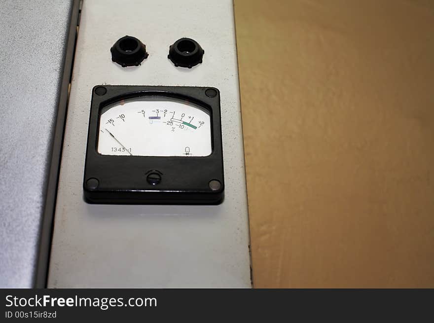 The old measuring tool on a background of a wall