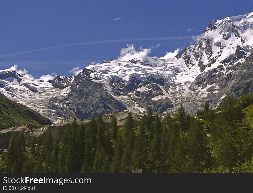 View on mountains in Italy, showing gletcher snow forrest with blue sky. View on mountains in Italy, showing gletcher snow forrest with blue sky