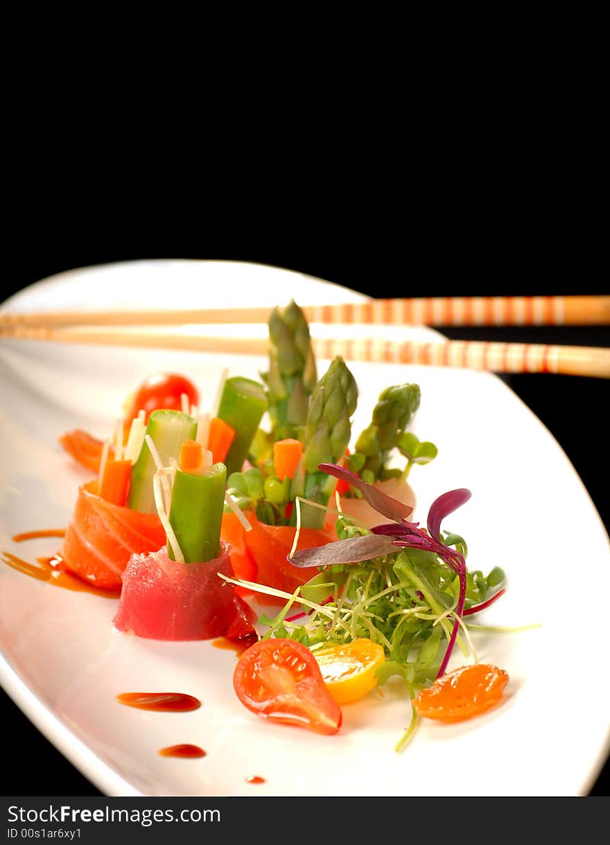 Japanese sashimi on a white plate