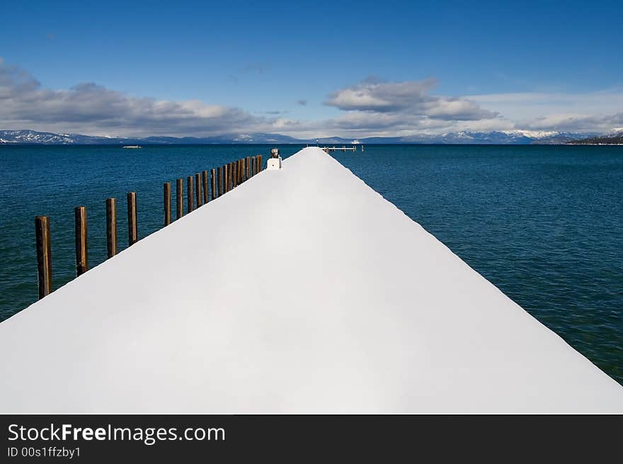 Public pier on the lake in winter