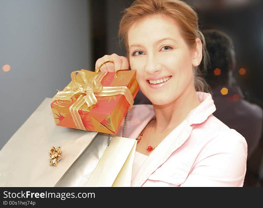 Smiling girl with a bags in the hands. Smiling girl with a bags in the hands