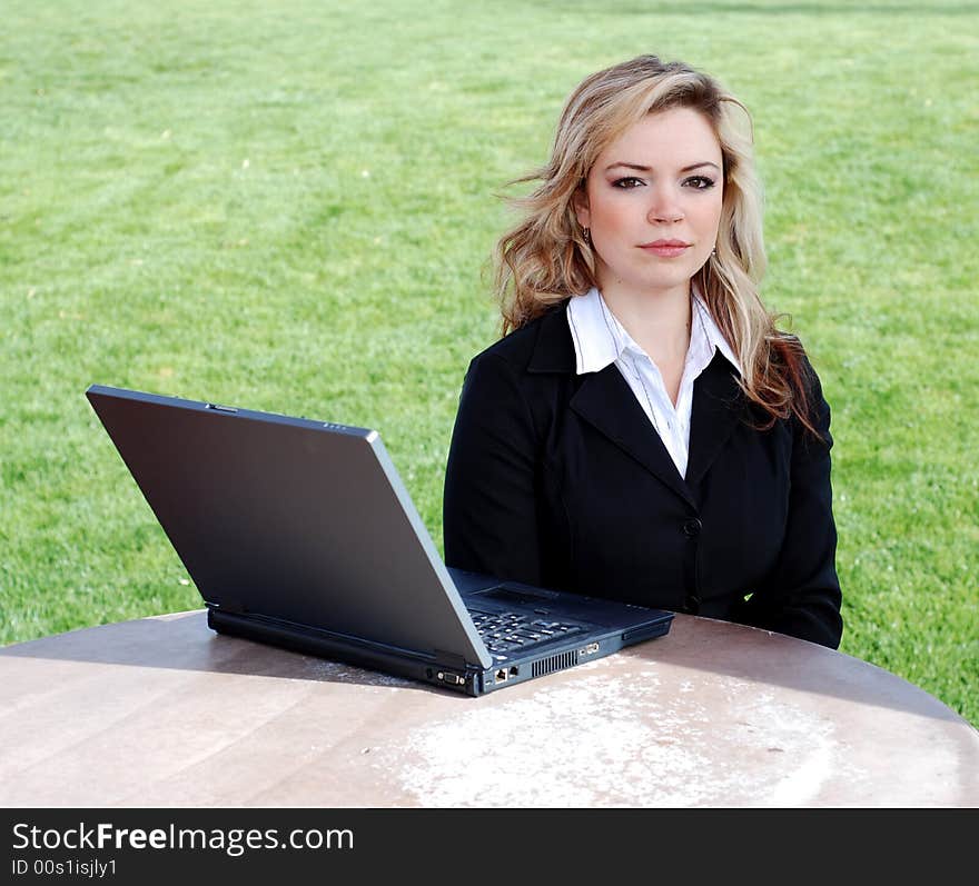 Portrait of a confident and successful businesswoman with a laptop. Portrait of a confident and successful businesswoman with a laptop