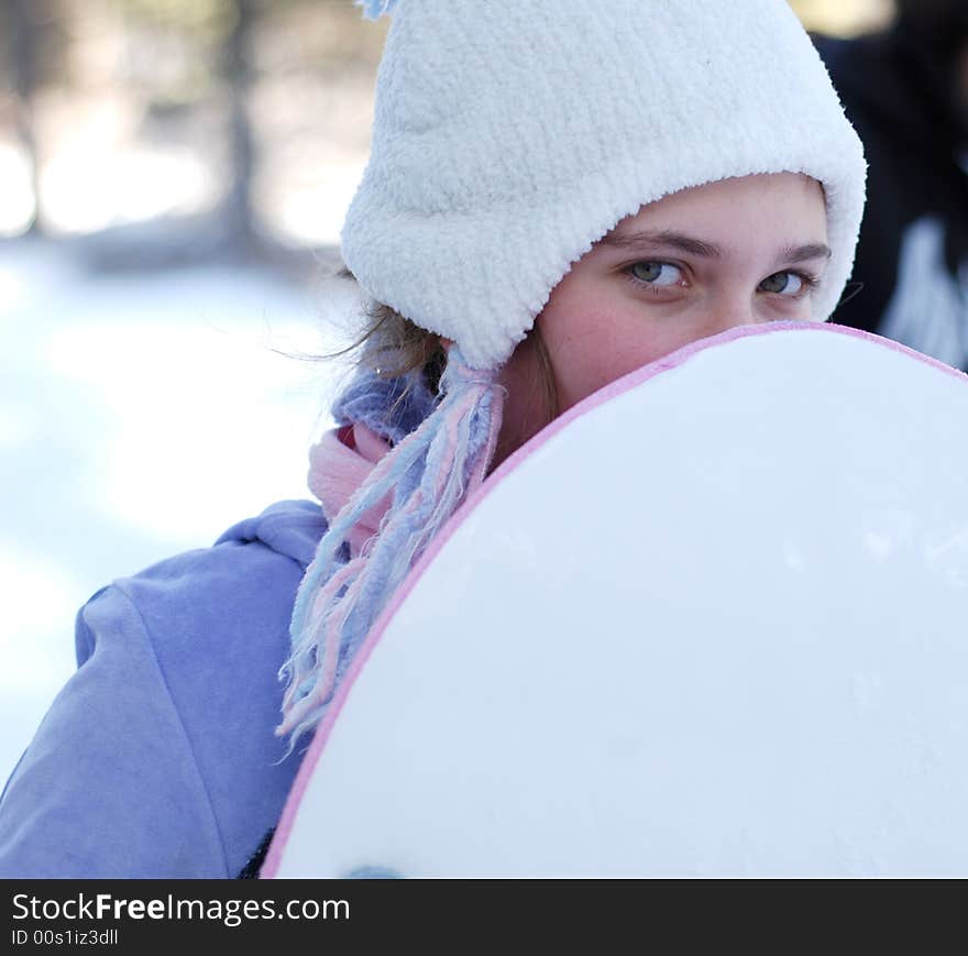 Young girl is playing in the snow. Young girl is playing in the snow