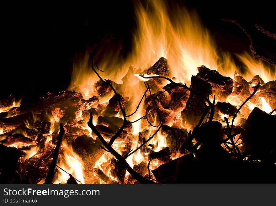 A big winter bonfire warms a chilly night. A big winter bonfire warms a chilly night.