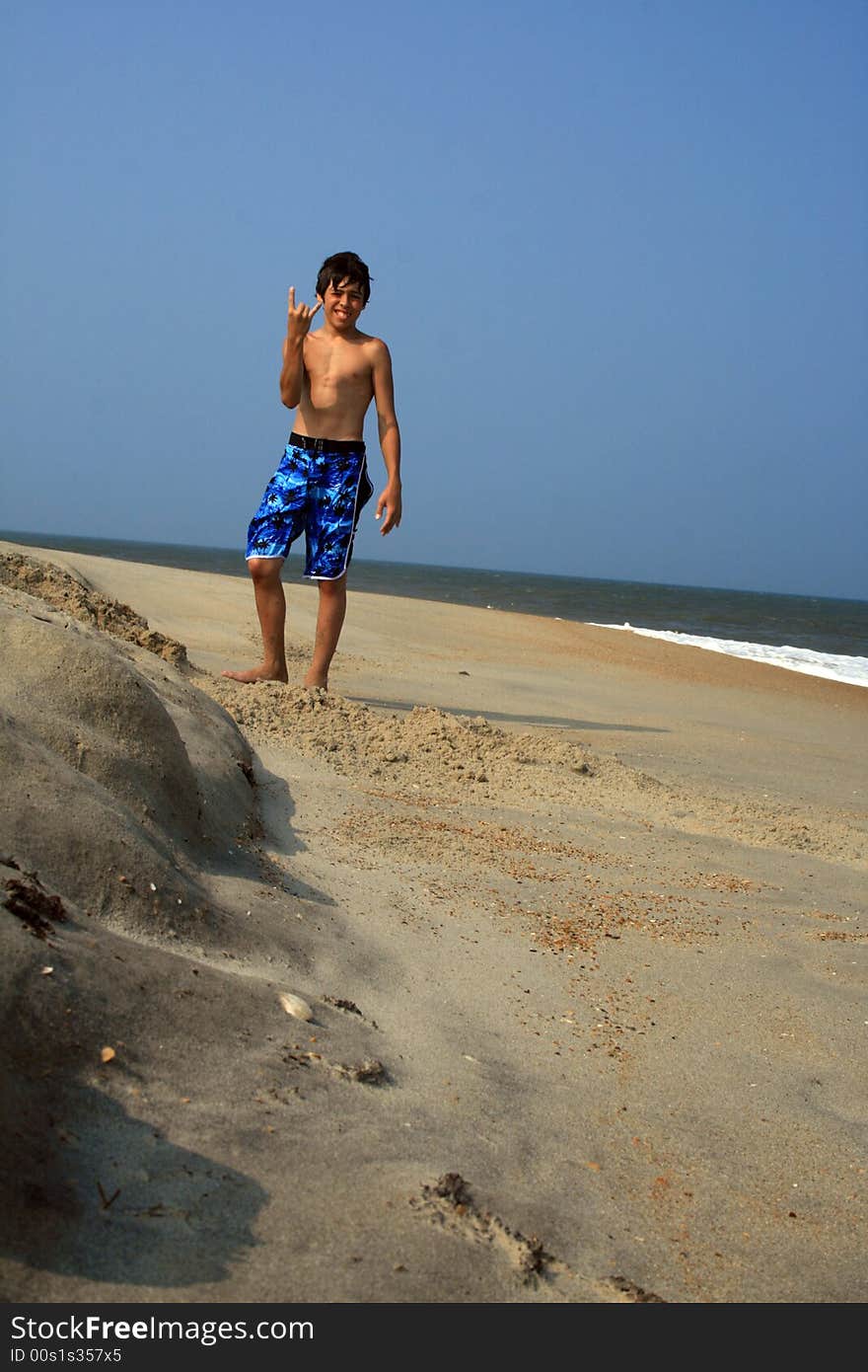 Boy Standing on Beach