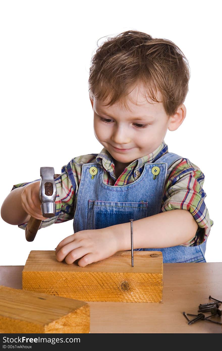 Kid Hammers A Hammer In Nails