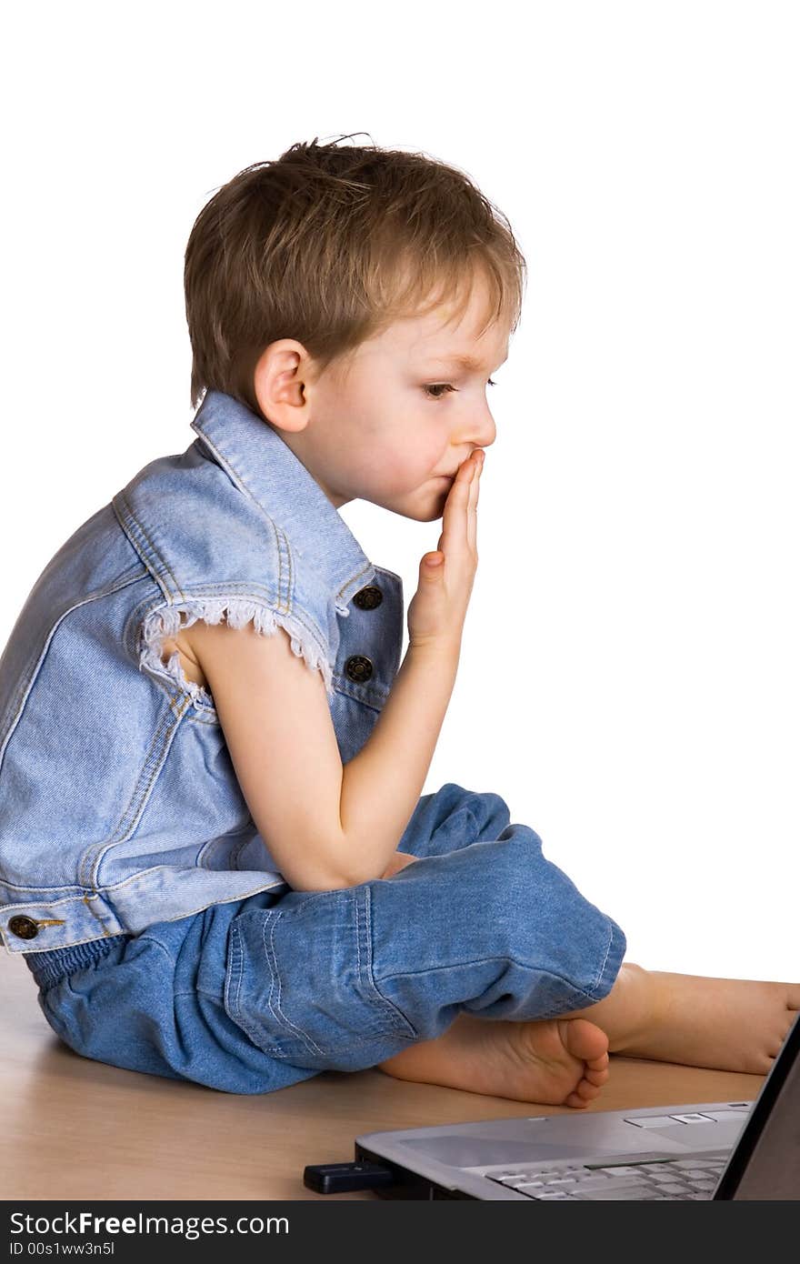 Kid watching a movie on a laptop