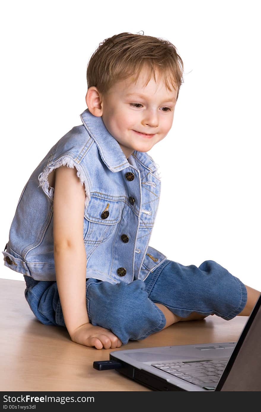 Child watching a movie on a laptop