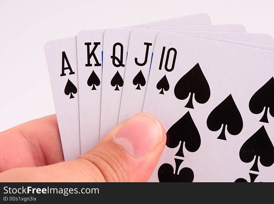 Poker player holding royal flush in hands. Poker player holding royal flush in hands