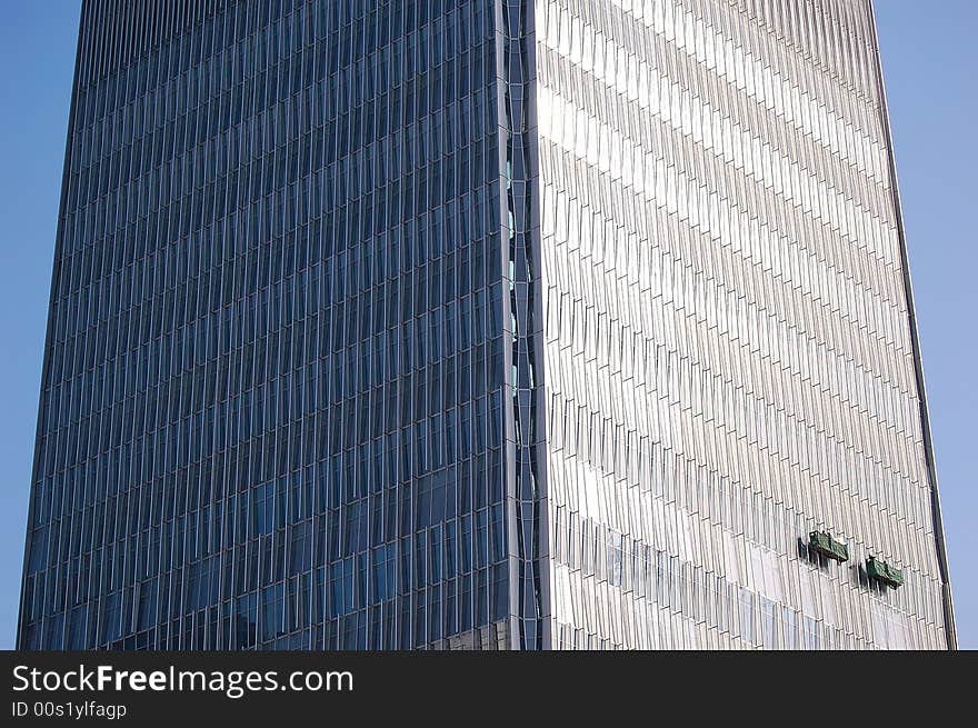 Window washers on a giant skyscraper. shot at the tallest building in Beijing. Window washers on a giant skyscraper. shot at the tallest building in Beijing.