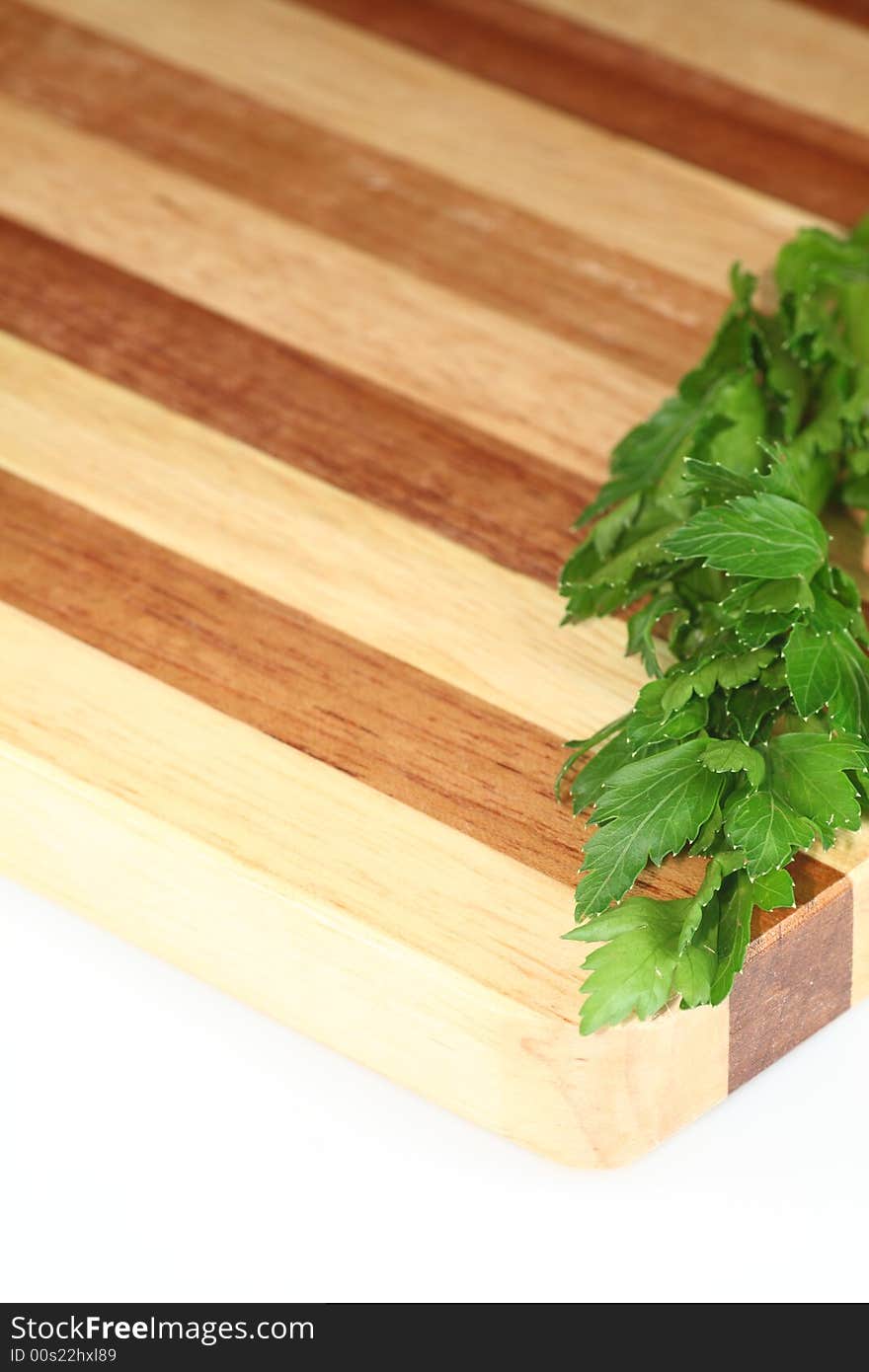 Parsley on the brown plank